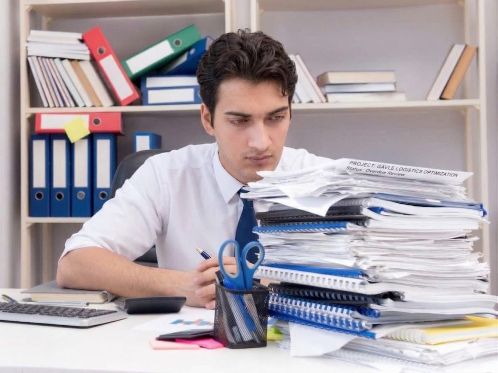 Illustration of office in Miami where work piles up because there is no CFO. An interim executive could be the solution.